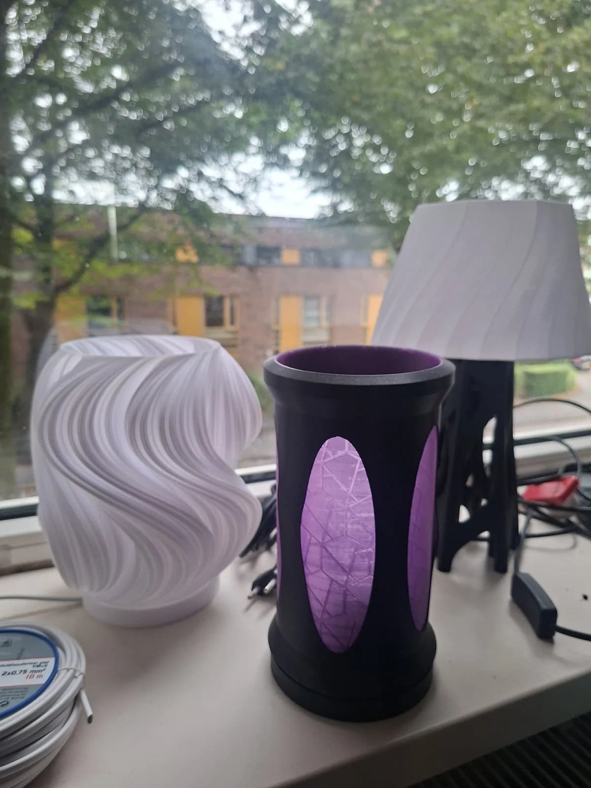 Three printed lamp designs, including a complete lamp with a switch.