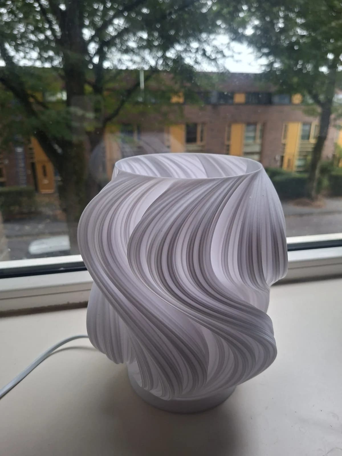 White ribbon-style shade with visible layer lines.
