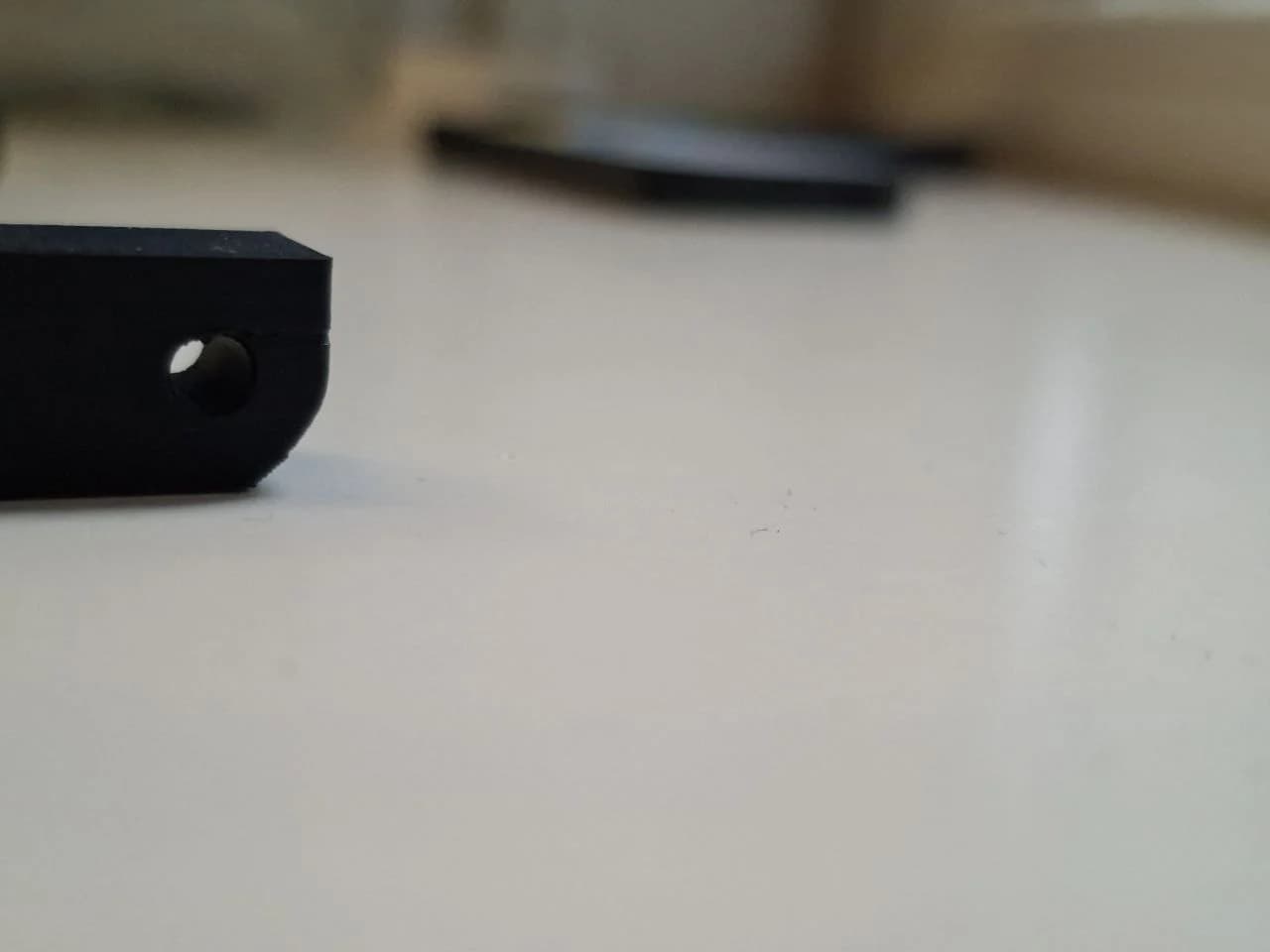 Side view of version 1 showing sagging bridge material at the top of the hole.