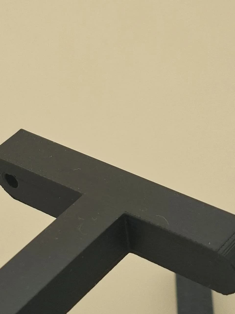 Ironed top surface of version 3 with a more even matte finish and remaining FDM texture.